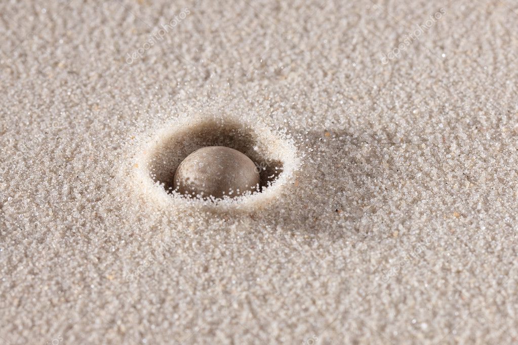 depositphotos_2263893-Stone-falling-down-in-sand.jpg